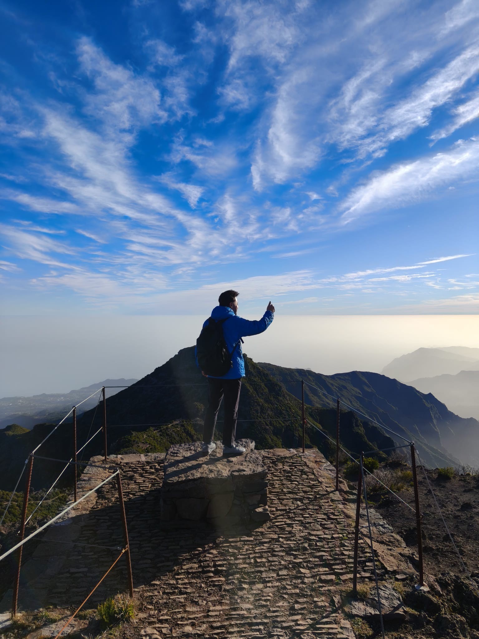 Christian Montoya at the top of Pico do Arieiro, Madeira, looking at the horizon.